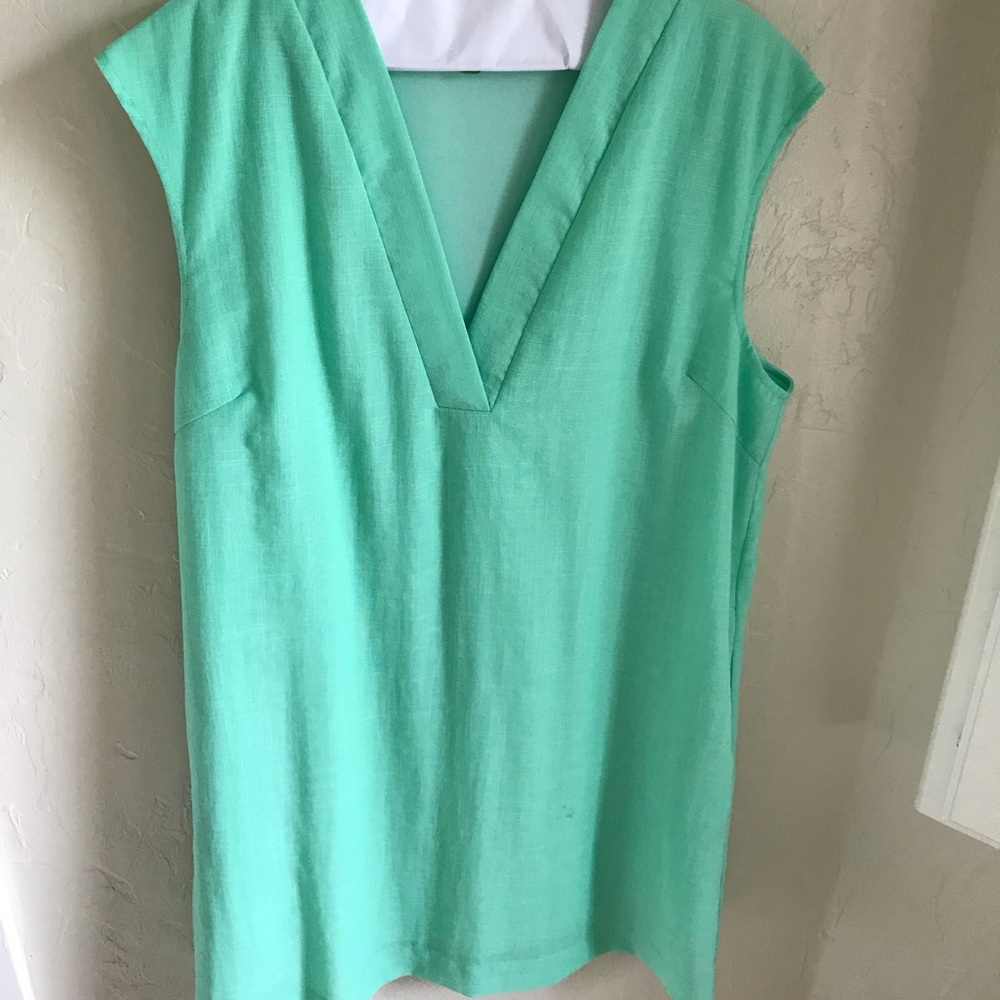 Sleeveless, low front dress